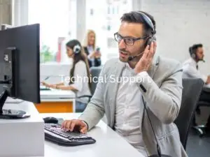 IT specialist providing technical support with computer equipment